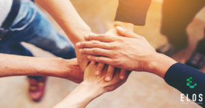 Concept of teamwork: Close-Up of hands business team showing unity with putting their hands together.